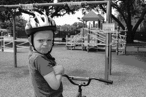 Grayscale dithered image of a kid being angry because park is closed
